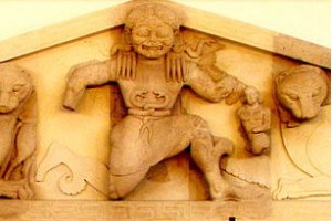 Detail of the pediment of the Temple of Artemis in Corfu (580BCE). The Gorgon in the center is flanked by lionesses and her sons, born from her blood when she was killed: on her right are the hind legs of her son Pegasus and on her left Chrysaor. In the Archeological Museum of Corfu. Source: Dr.K via Wikimedia Commons.